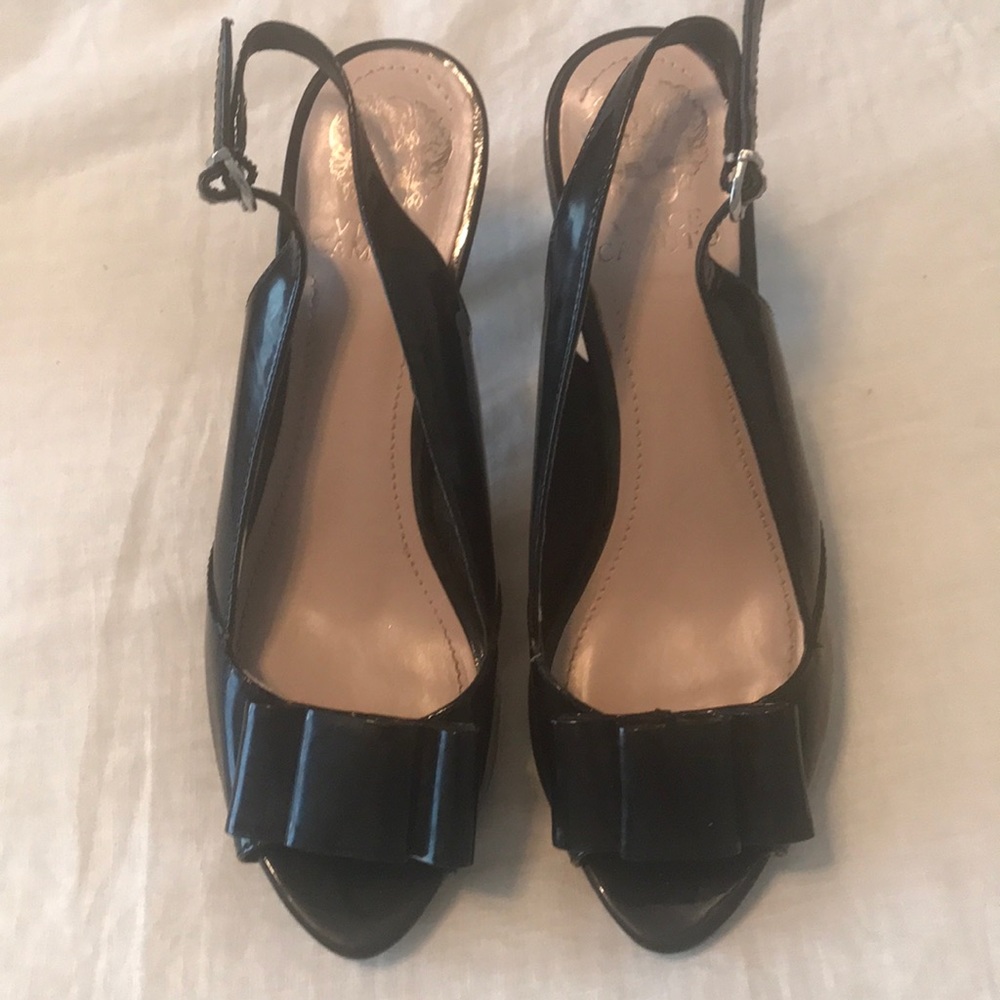 Black patent leather heels with bows